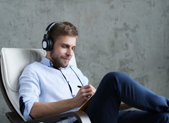 handsome-man-listening-music-on-headphones-2-scaled