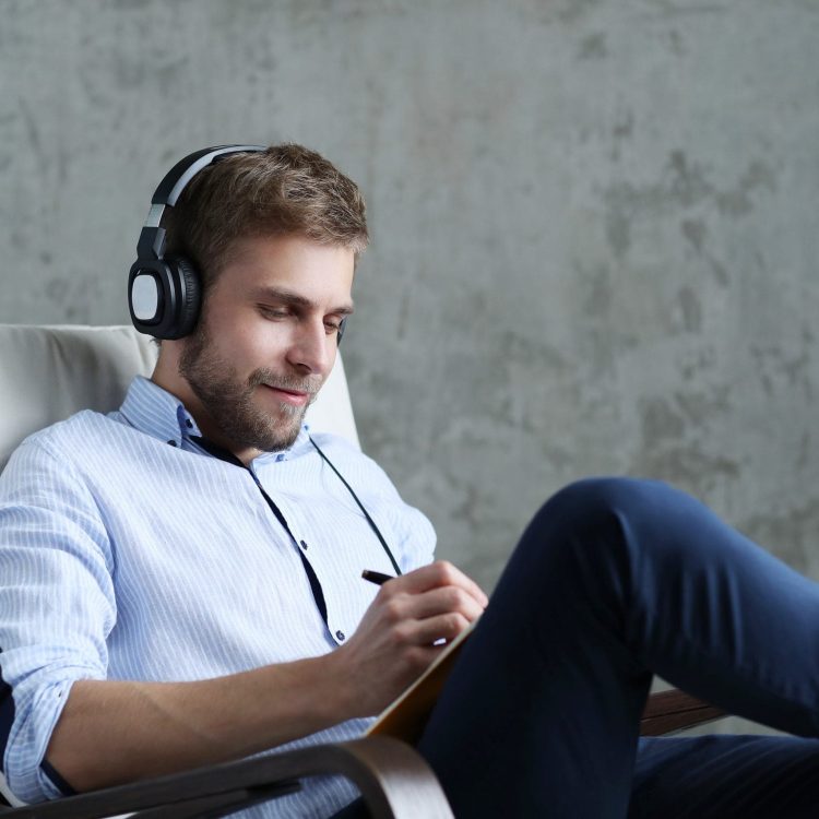 handsome-man-listening-music-on-headphones-2-scaled